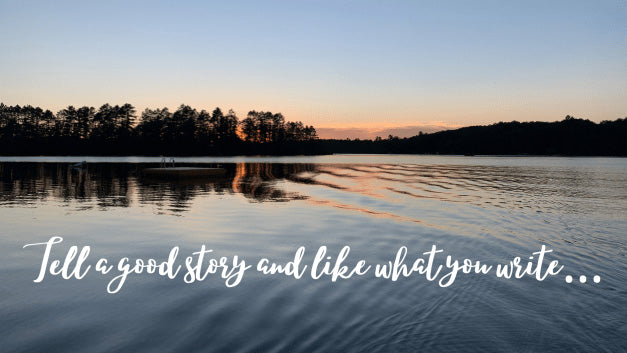 Picture of a northern lake with the words "Tell a Good Story and Like What your Write" on it.